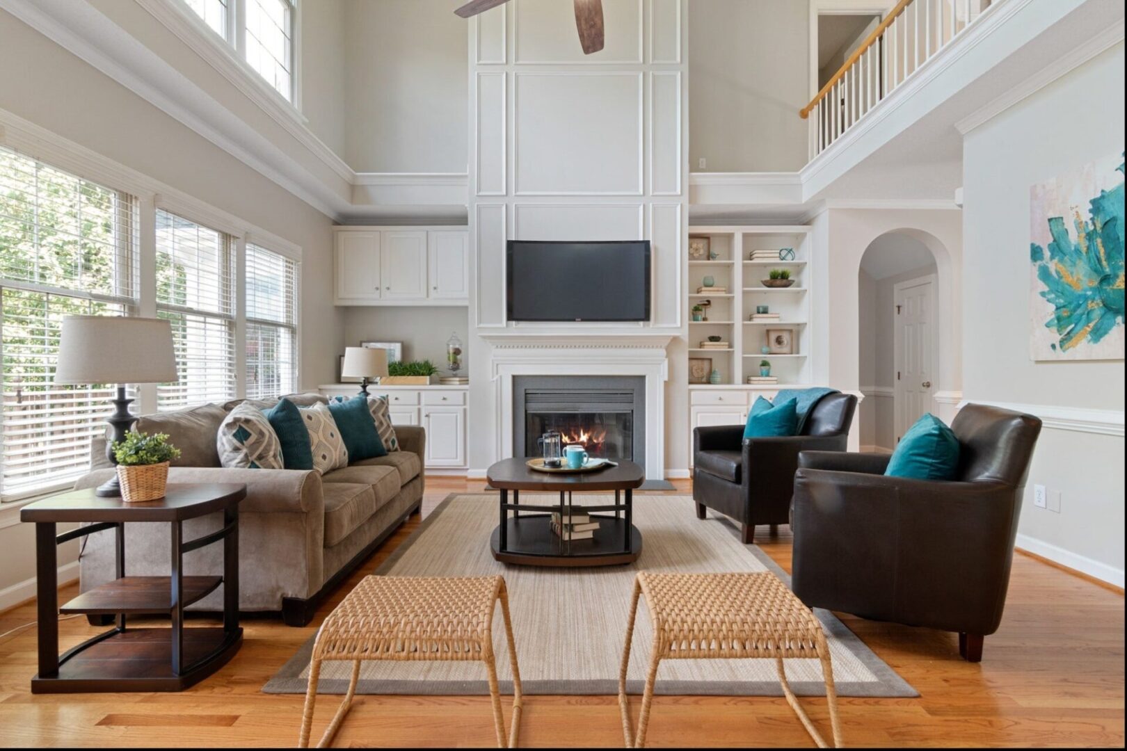 A living room with two couches and a fireplace.