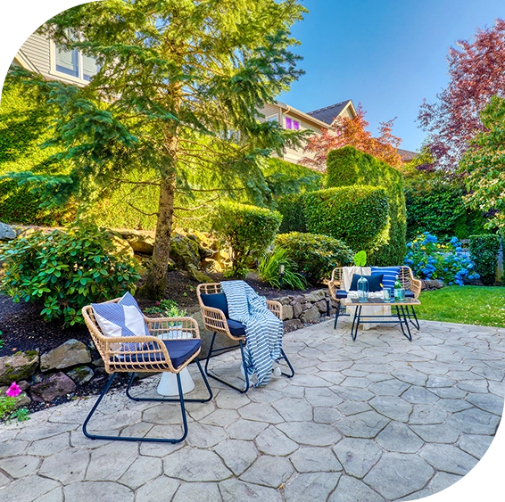 A patio with chairs and tables in the middle of it.