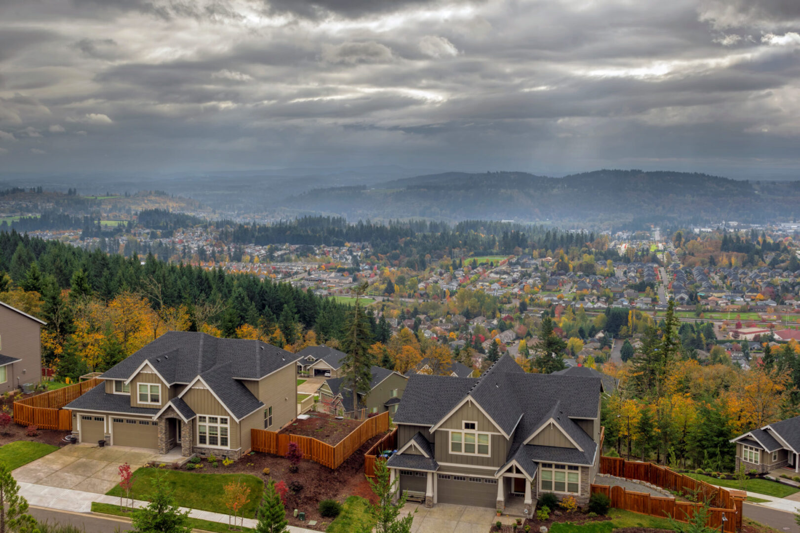 A view of houses and the city from above.