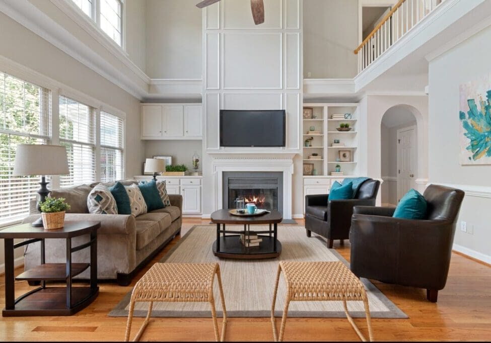 A living room with two couches and a fireplace.